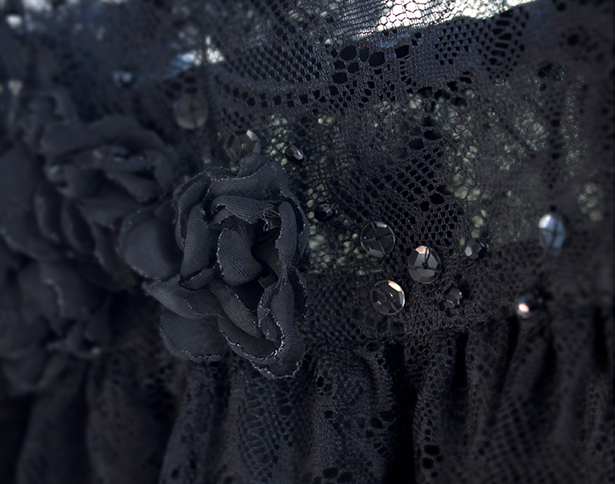 Lace dress with sequins and artificial flowers