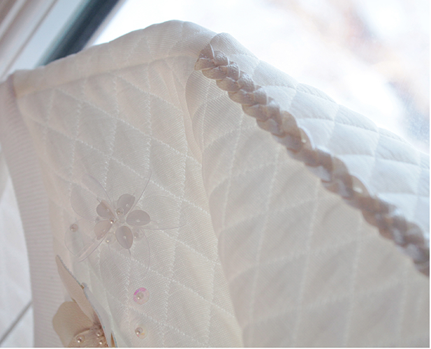 Quilted jumper with faux leather and sequin bead flowers