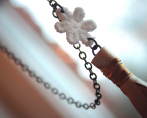 Long statement necklace with lace flower and leather tassel